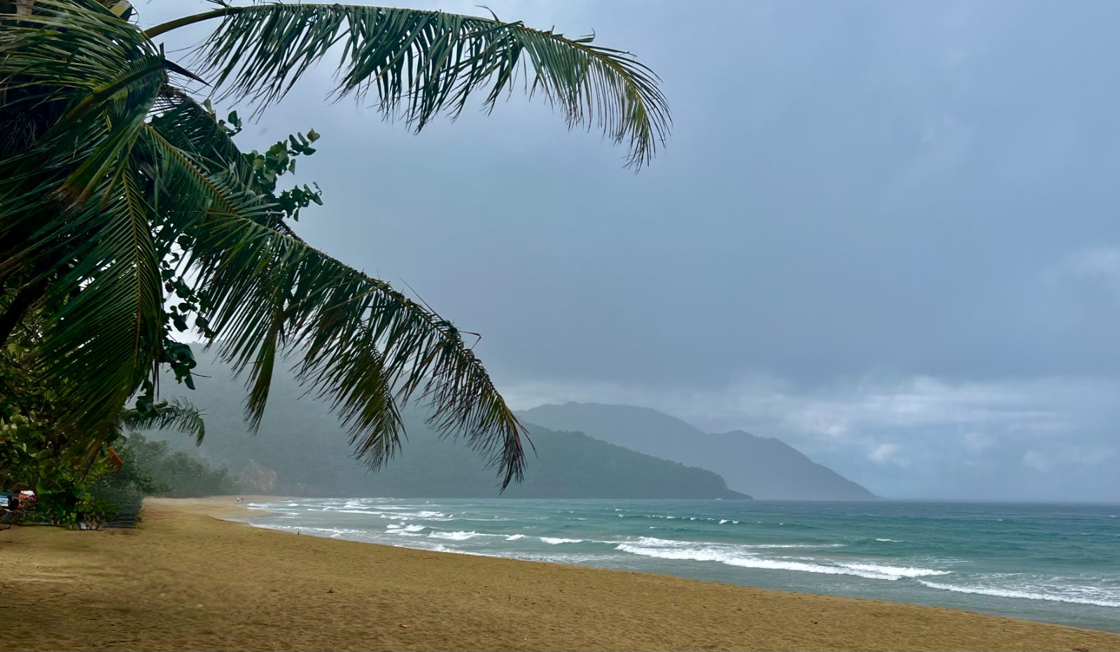 The beach under a passing rain squall