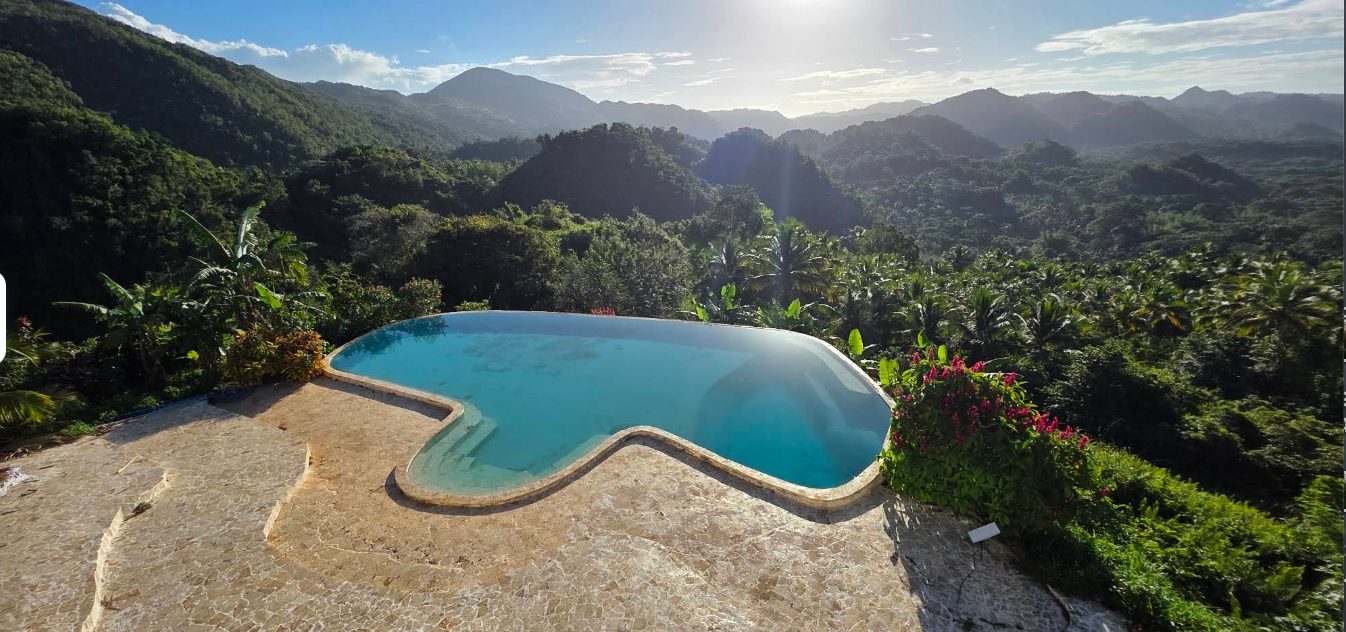 An infinity pool looking out over the valley and the mountains